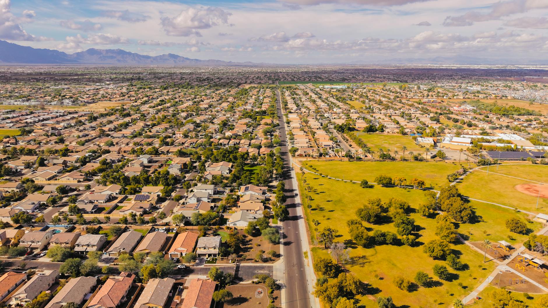 Stunning aerial view of a suburban neighborhood in Arizona with clear skies.